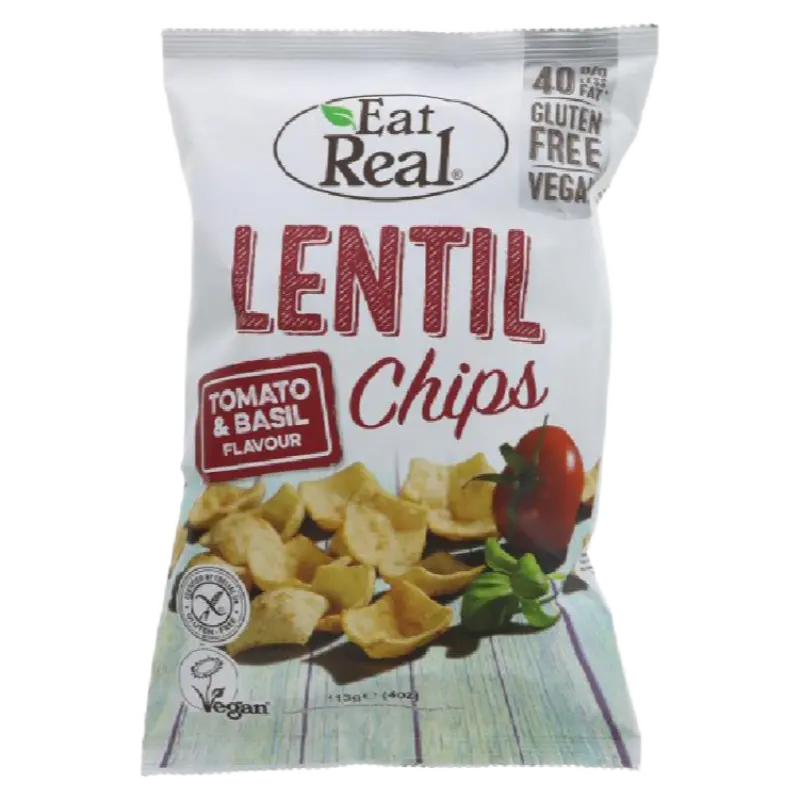 A bag of Eat Real Lentil Chips in Tomato & Basil Flavour, featuring a white bag with red and green text, a photo of potato chips, and a tomato and basil garnish.