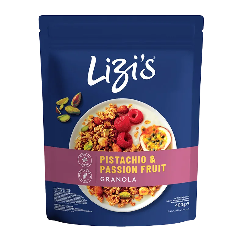 A 400g stand-up pouch of Lizi's Pistachio & Passion Fruit Granola on a plain white background. The packaging is dark blue with a pink band and a central photo of the granola served on a plate with raspberries, pistachios, and a passion fruit slice.