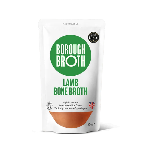 A 322g stand-up pouch of Borough Broth Lamb Bone Broth on a white background. The packaging is white with a prominent green circular logo containing the brand name 'BOROUGH BROTH' in white, green text for 'LAMB BONE BROTH', and a brown section at the bottom representing bone broth.