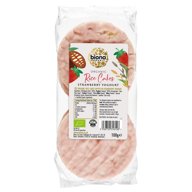A 100g package of Biona Organic Organic Rice Cakes Strawberry Yoghurt, showing the pinkish-red cake slices inside a clear plastic bag with a white and green label.