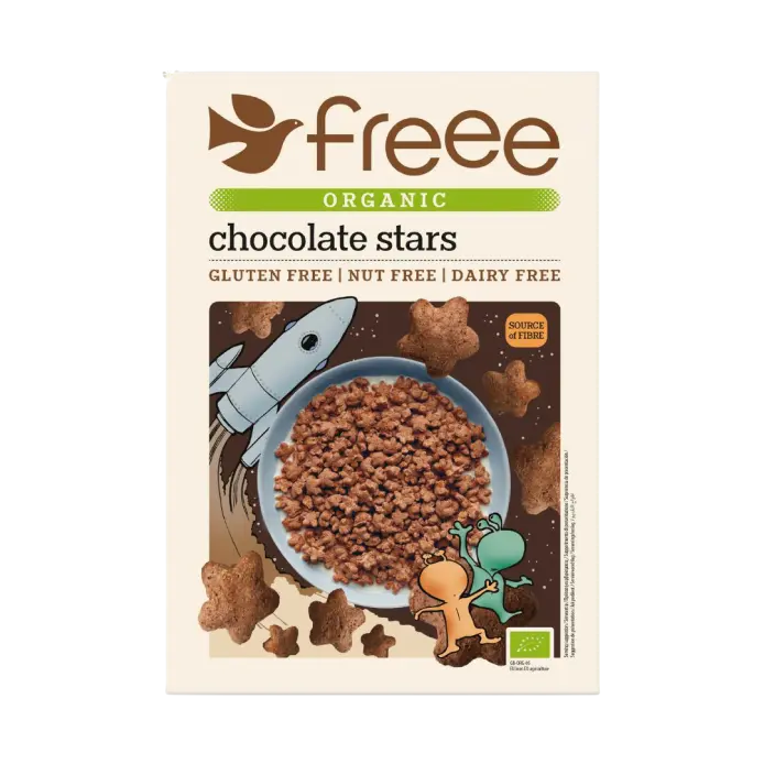 Front of a Freee Organic Chocolate Stars cereal box on a plain white background. The package is cream-colored with brown and green text, featuring a central illustration of chocolate stars in a bowl with a cartoon rocket and alien.