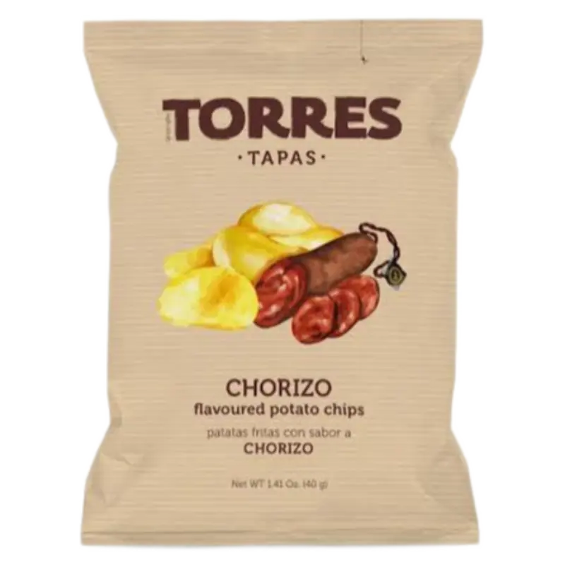 A single bag of Torres Tapas Chorizo flavoured potato chips on a plain white background. The packaging is a light tan color with dark brown text and an illustration of potato chips, chorizo sausage, and a tortilla chip in the center.