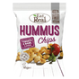 A bag of Eat Real Hummus Chips, Tomato & Basil flavour, on a white background. The packaging is white with purple text and features an illustration of golden-brown chips, a red tomato, and green basil.